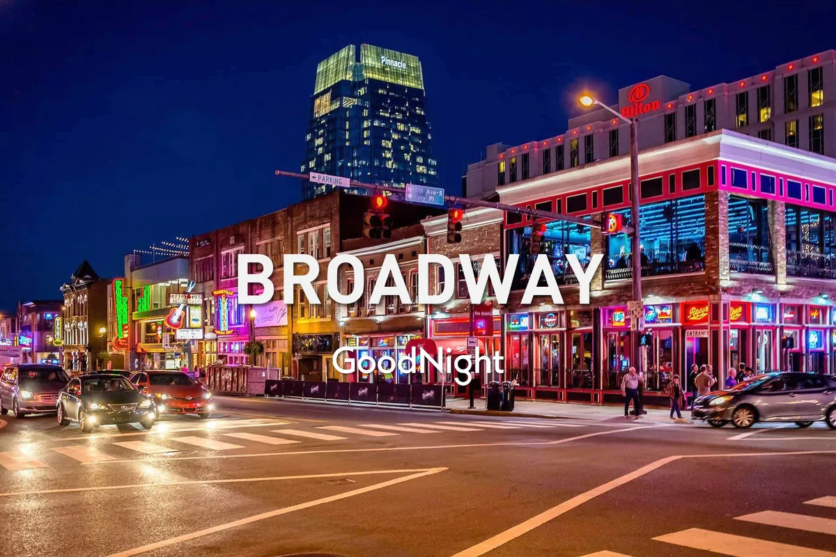 A bustling city street at night illuminated by vibrant neon signs, with people walking and a high-rise building in the background. The scene pulses with energy, suggesting nightlife, dining, live music, and urban excitement.